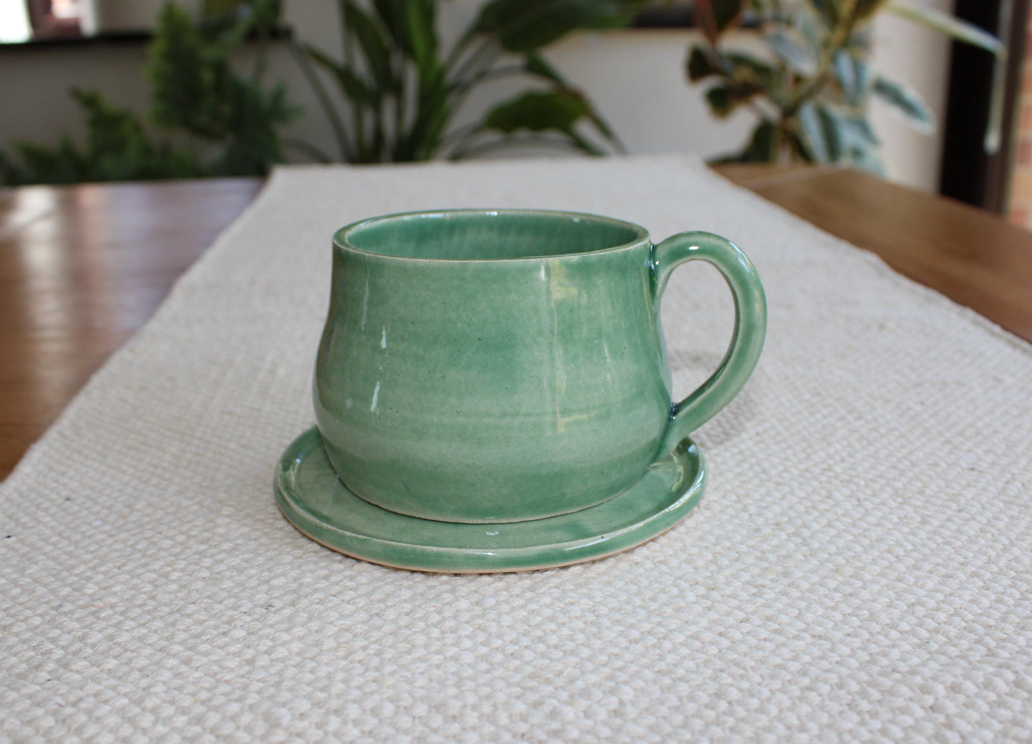 Green cup with saucer
