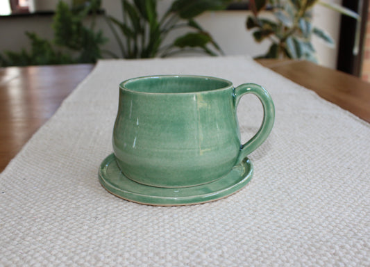 Green cup with saucer